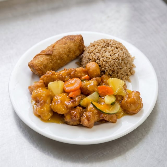 No. 10. Sweet & Sour Chicken Egg Roll & Fried Rice Lunch Only.